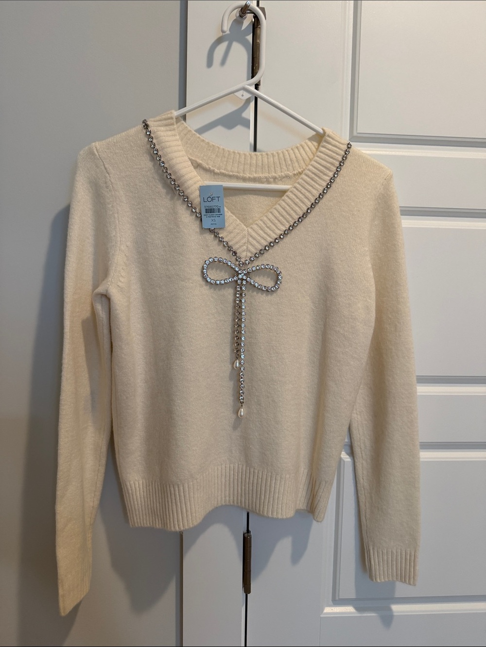LOFT Cream V-Neck Sweater with Rhinestone Bow Accent